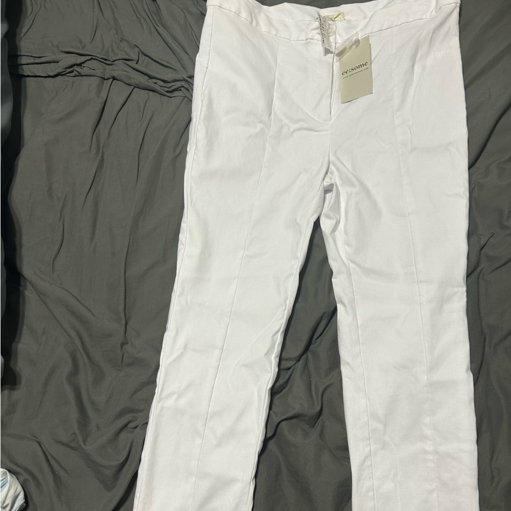 New white slim leg pants with slit on bottom of legs
